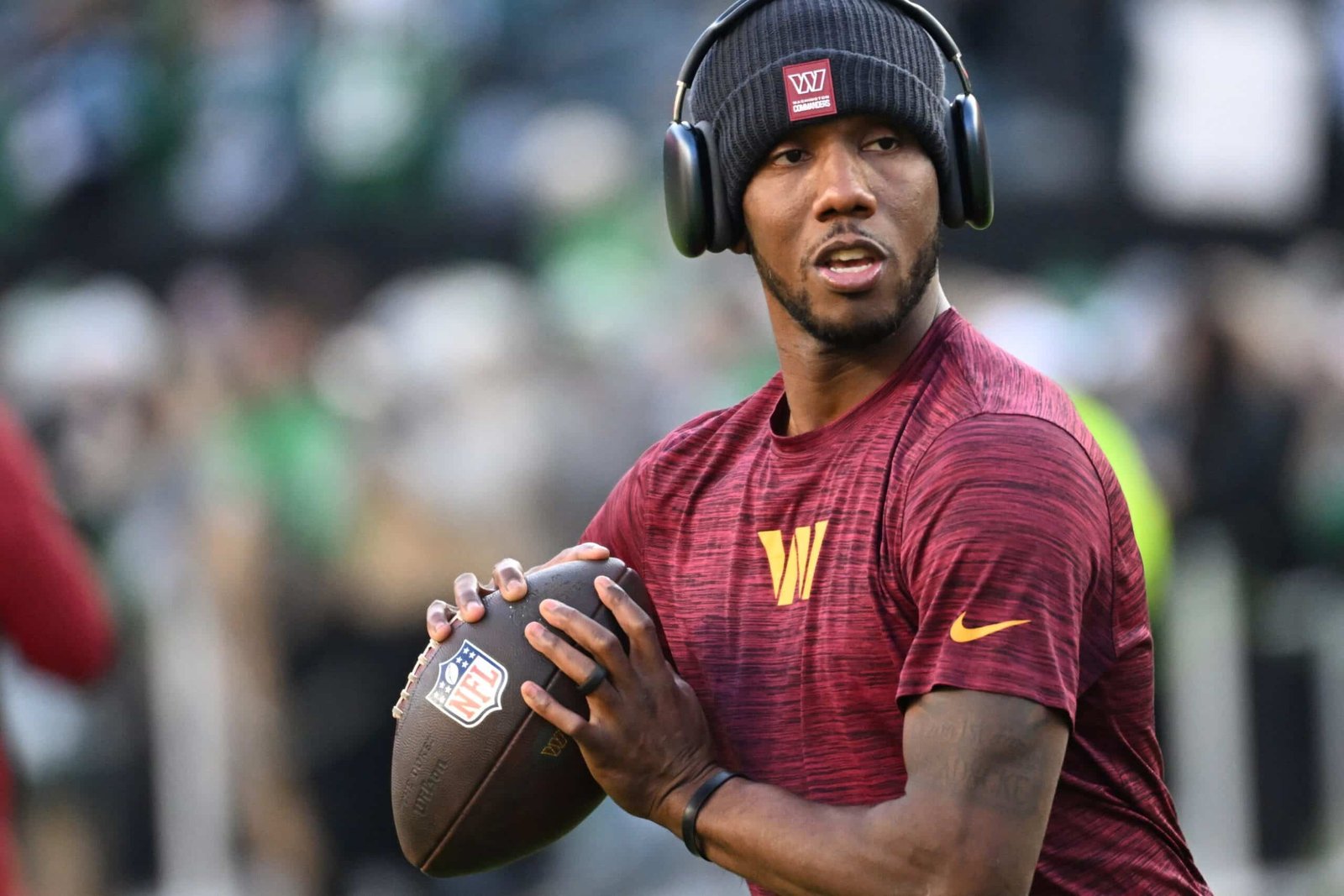 Jan 4, 2026; Philadelphia, Pennsylvania, USA; Former LSU QB/Washington Commanders quarterback Jayden Daniels (5) during warmups against the Philadelphia Eagles at Lincoln Financial Field. Mandatory Credit: Eric Hartline-Imagn Images