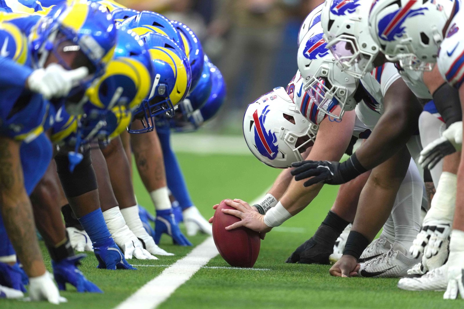 Dec 8, 2024; Inglewood, California, USA; Helmets at the line of scrimmage as Buffalo Bills long snapper Reid Ferguson (69) snaps the ball against the Los Angeles Rams at SoFi Stadium. Mandatory Credit: Kirby Lee-Imagn Images
