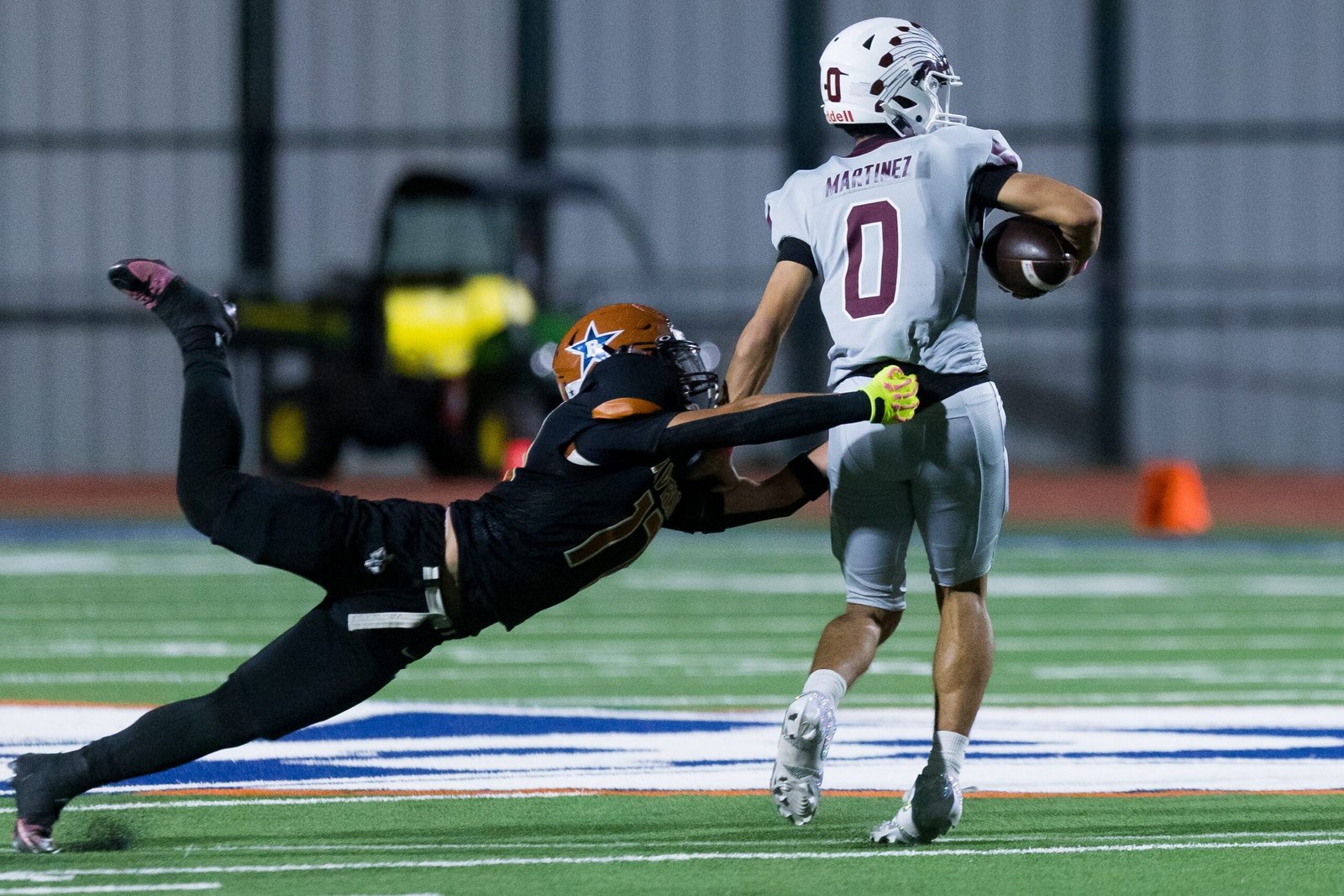 Ysleta’s Rodrigo Martinez runs with the ball as Riverside’s Phillip Ramos attempts a tackle at Riverside High School in El Paso, Texas, Friday, Oct. 9, 2026.