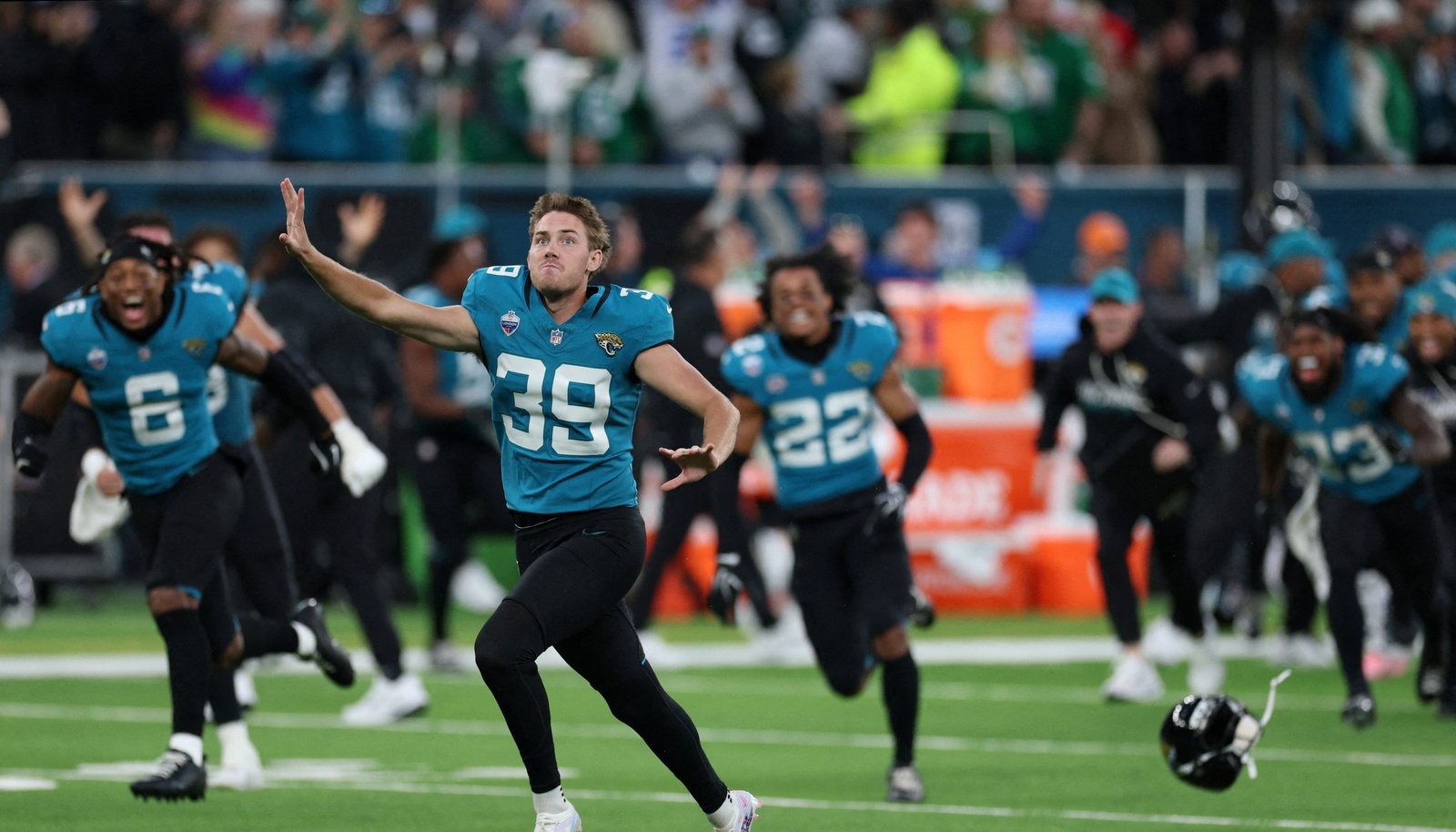 Jacksonville Jaguars kicker Cam Little (39) celebrates with teammates after kicking the game winning field goal to defeat the Philadelphia Eagles at Tottenham Hotspur Stadium.